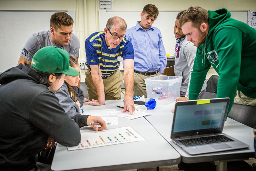 Dr. Matthew Symonds instructs students in a health science abilities lab. (Photo by Todd Weddle/Northwest Missouri State University)